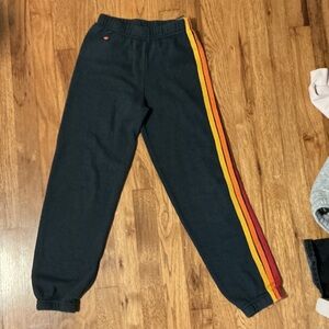 Aviator Nation Black Sweatpants with Yellow & Red Side Stripes